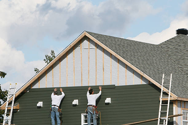 Professional Siding technician working in Rex, GA